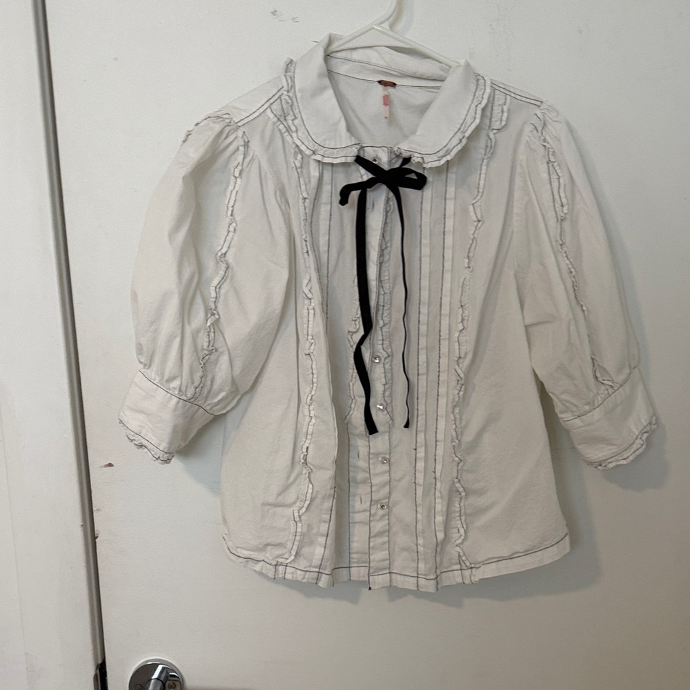 White Ruffled Button-Up Blouse with Black Bow